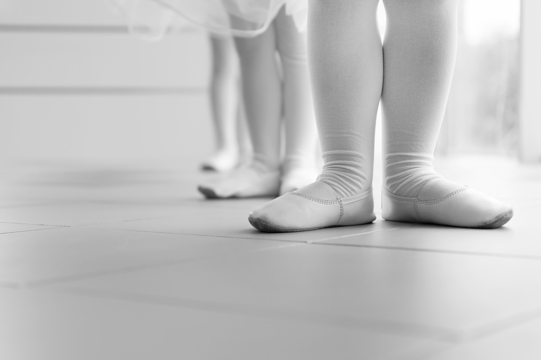 Little Ballerina Feet in a Row at Ballet Class
